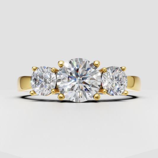 Round Diamond three-stone engagement ring in polished yellow gold