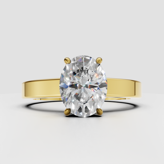 Oval solitaire diamond engagement ring in yellow gold