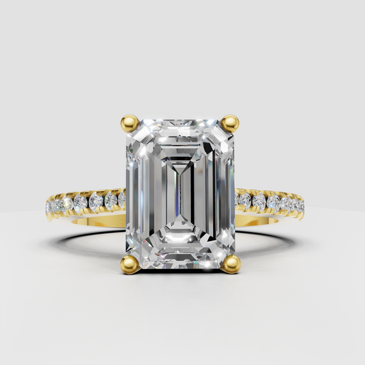 Emerald cut diamond pavé engagement ring in polished yellow gold
