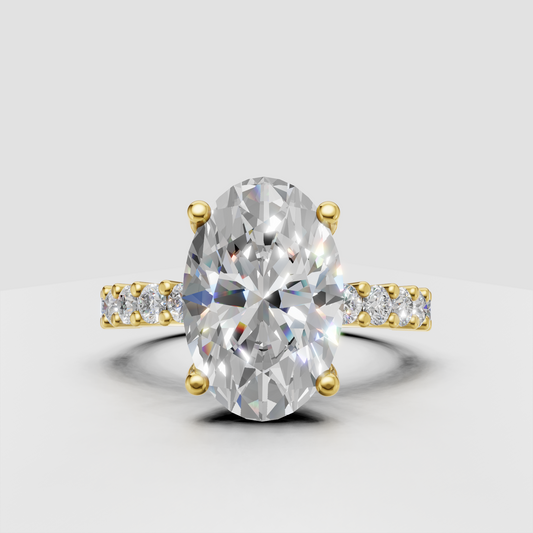 Oval diamond four-prong yellow gold engagement ring with baguette side stones