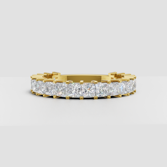 Cushion cut diamond eternity band in polished yellow gold
