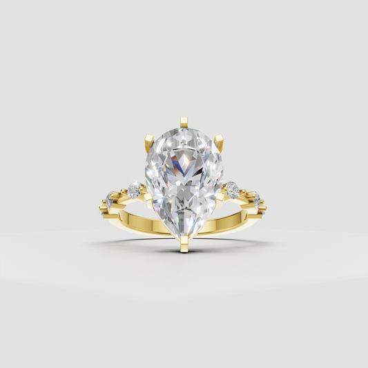 Pear cut diamond cathedral prong engagement ring with side stones