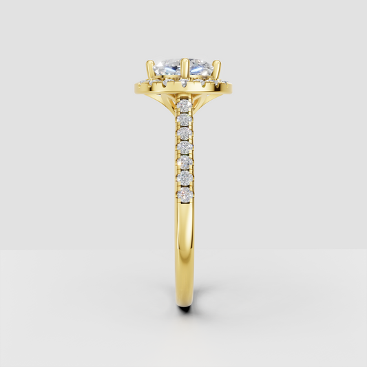 Yellow gold cushion diamond engagement ring with halo setting and side stones