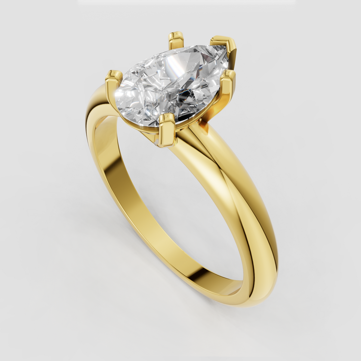 Pear shaped diamond ring featuring a classic solitaire prong setting and smooth gold band