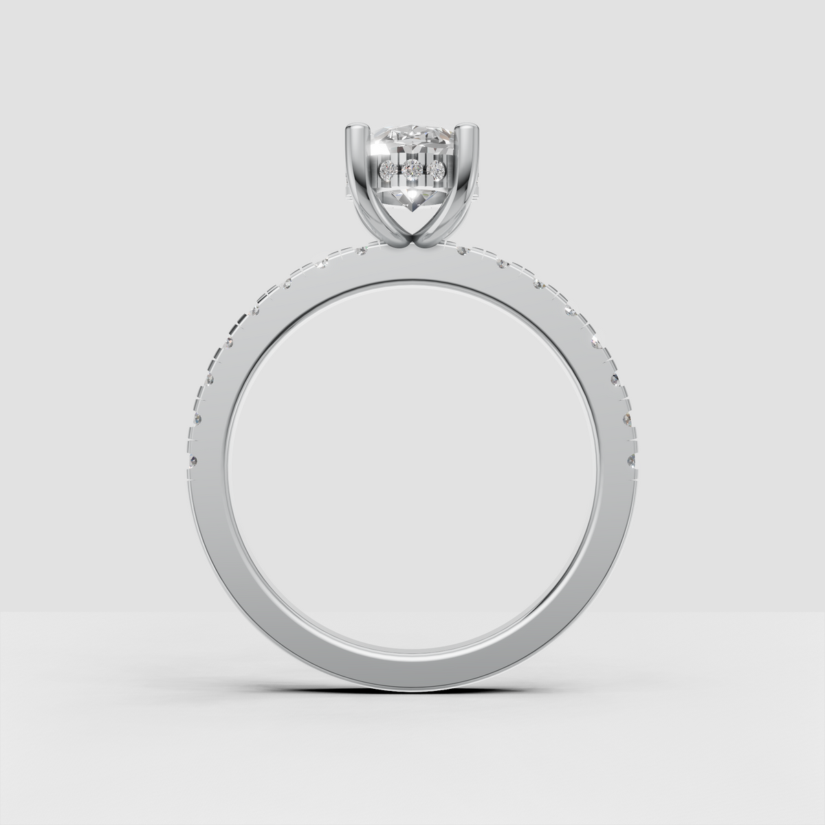 Classic oval diamond ring designed with a four-prong center setting and hidden halo.