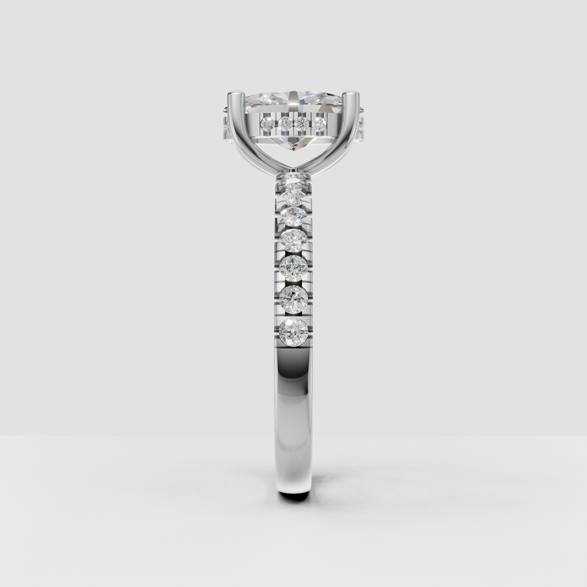Oval cut diamond bridal ring with hidden halo and smooth tapered gold shank.