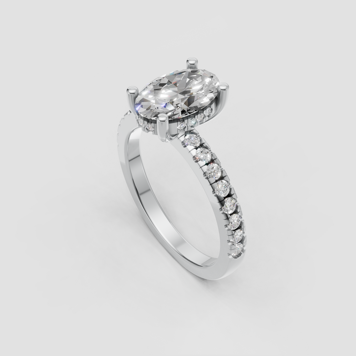 Close-up oval diamond engagement ring with polished gold band and elegant four-prong setting.