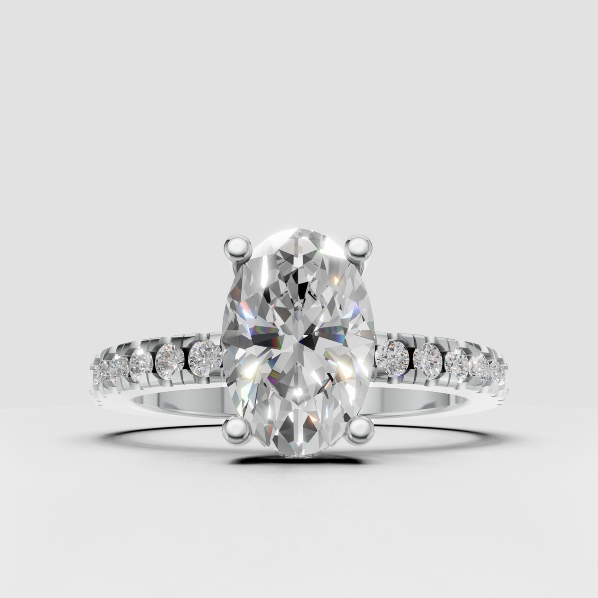 Side view of oval diamond solitaire ring showing hidden halo accents beneath the center stone.