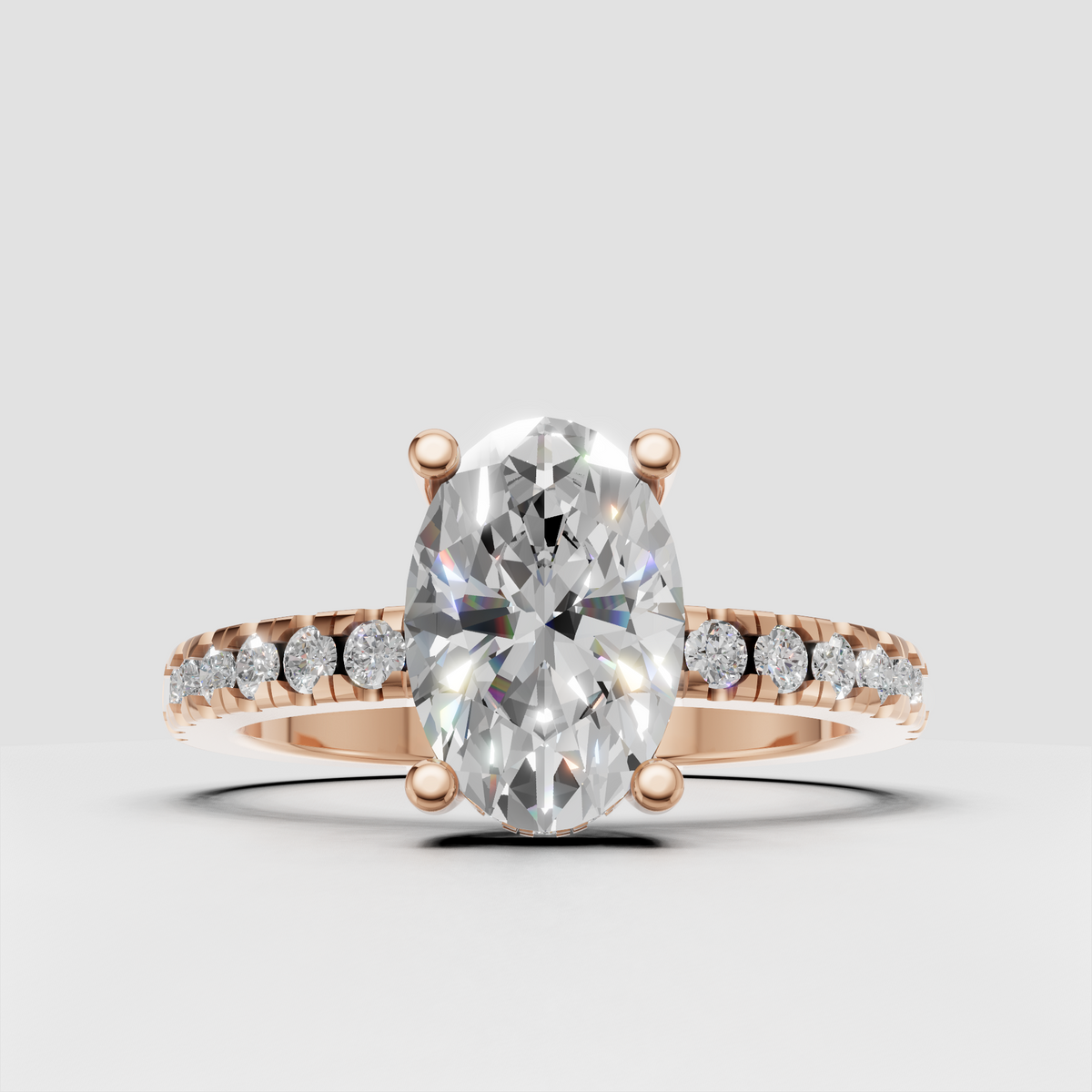 Refined oval diamond wedding ring with four-prong setting and sleek gold band.