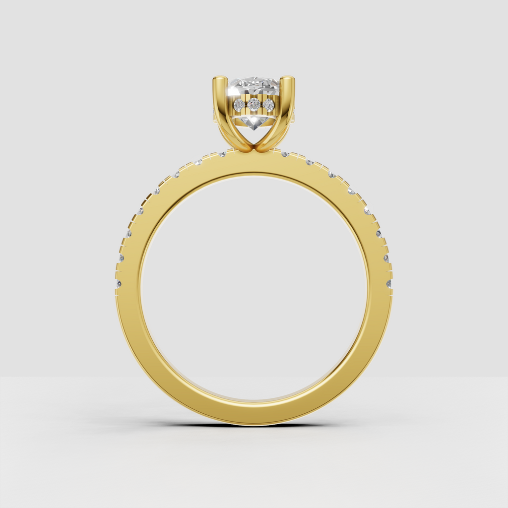 Oval bridal ring with polished gold shank and brilliant hidden halo underneath the center stone.