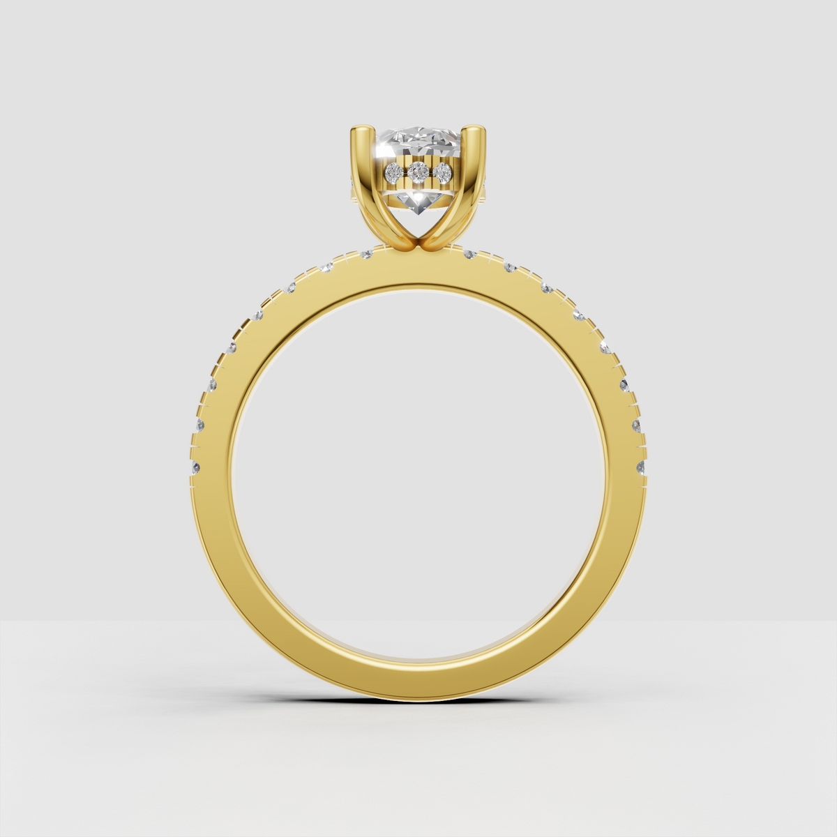 Oval bridal ring with polished gold shank and brilliant hidden halo underneath the center stone.