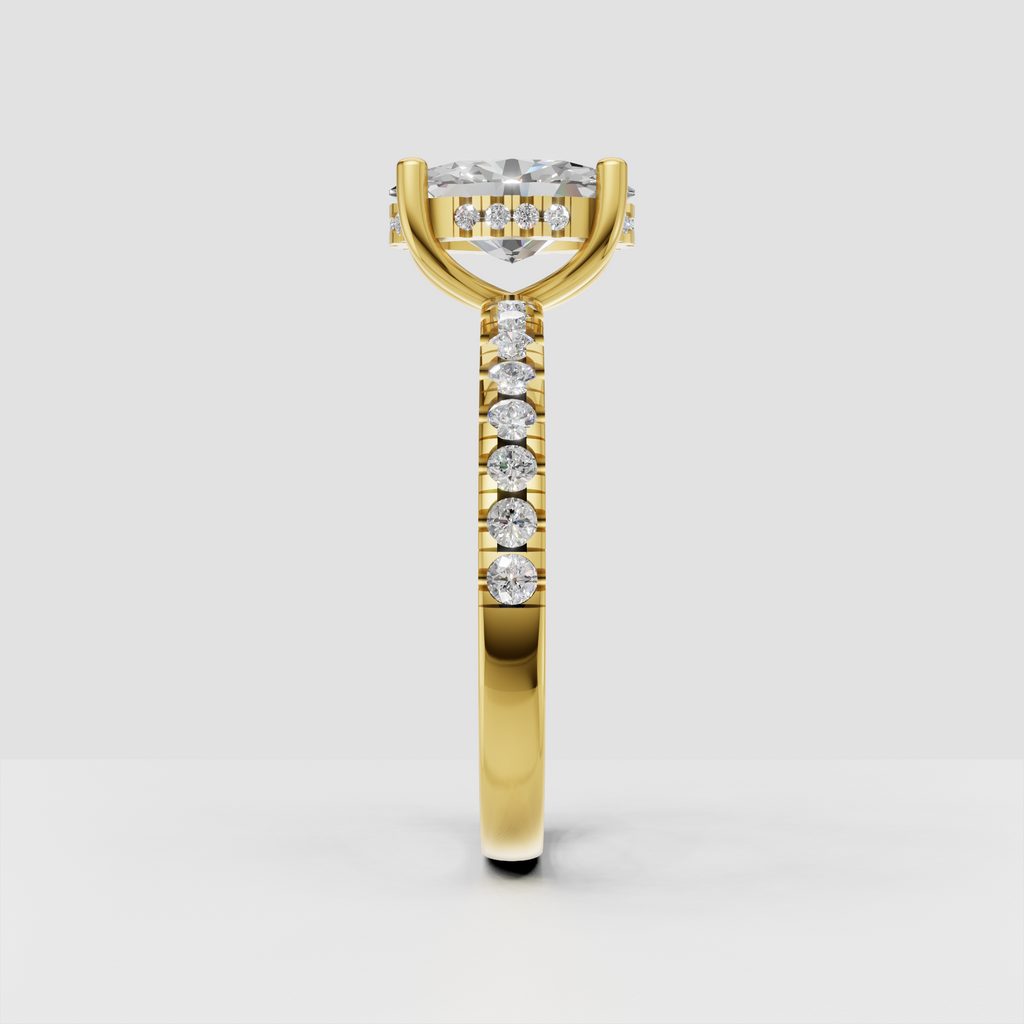 Elegant oval diamond engagement ring with four gold prongs and hidden halo detail.