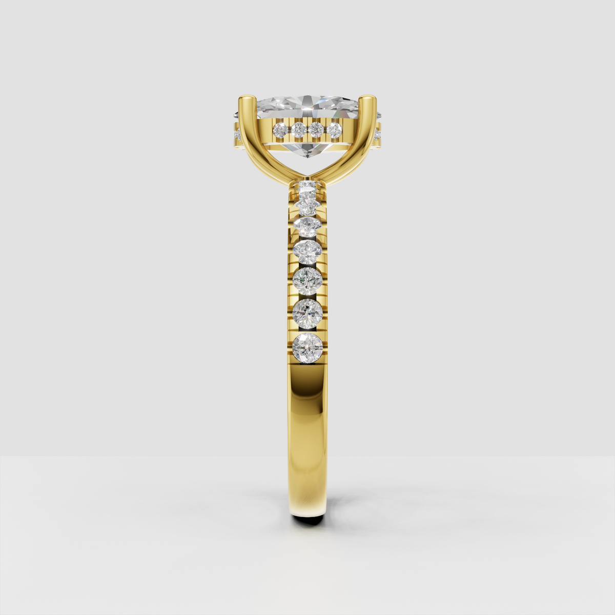 Elegant oval diamond engagement ring with four gold prongs and hidden halo detail.