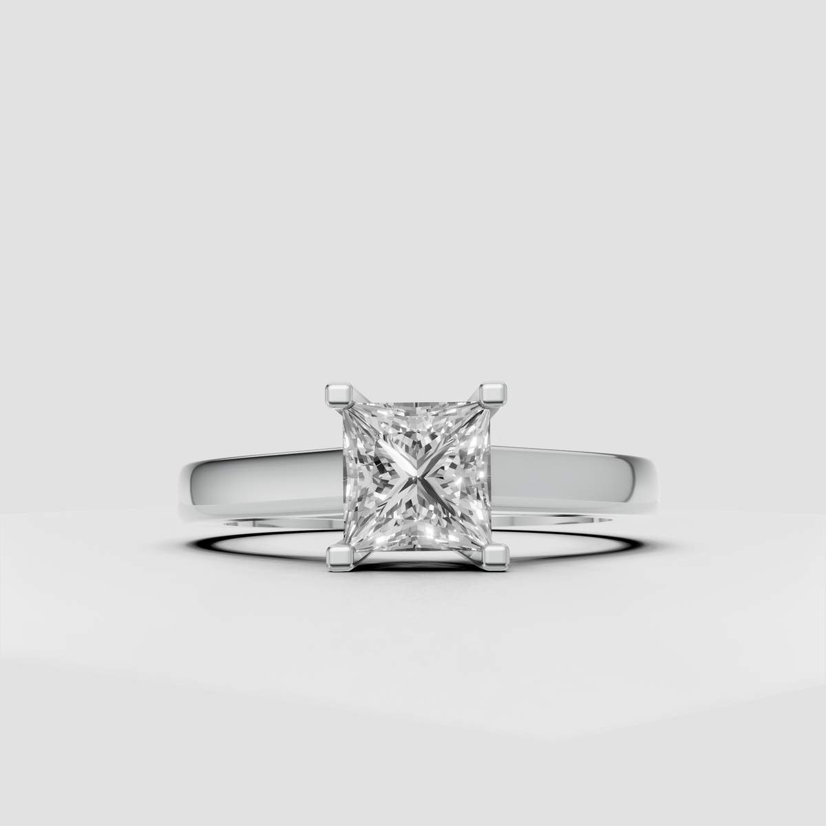 Classic four-prong princess diamond ring with smooth tapered shoulders