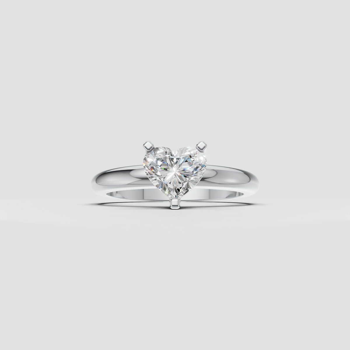 Side view of heart diamond solitaire ring showing elevated setting
