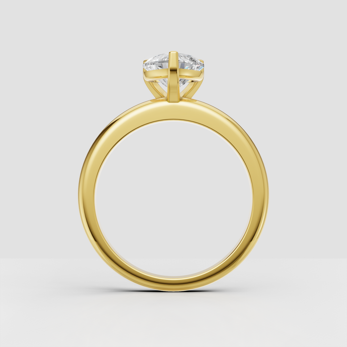 Romantic heart-shaped center stone engagement ring with sleek polished band

