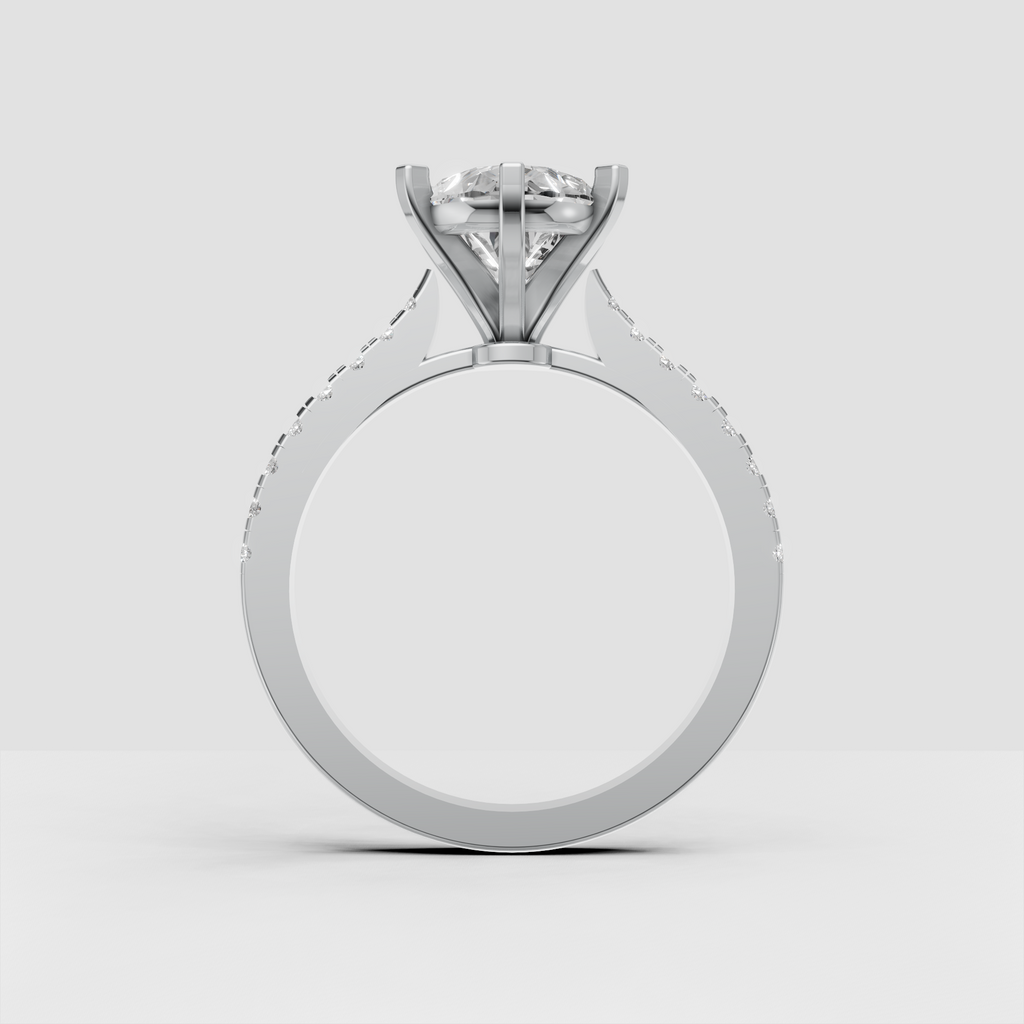 Pear diamond bridal ring shown from an angled view with pavé-set side stones