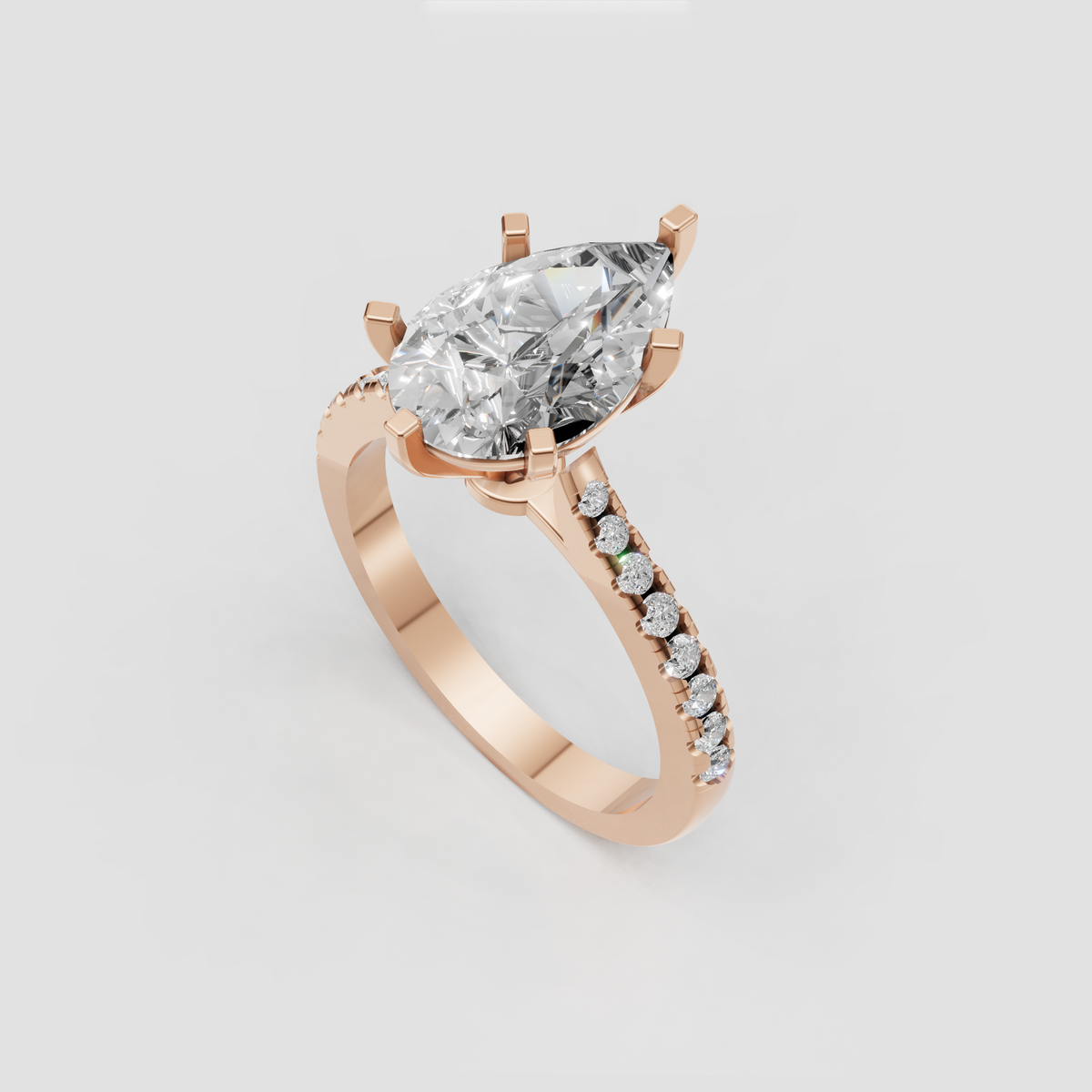 Pear brilliant engagement ring with multi-prong crown and delicate pavé band
