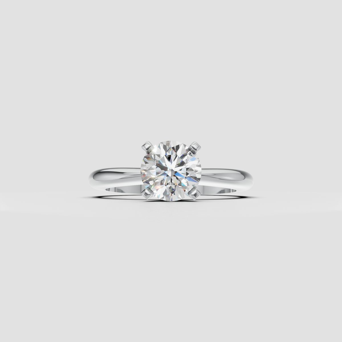 Round brilliant center diamond engagement ring with elevated four-prong basket