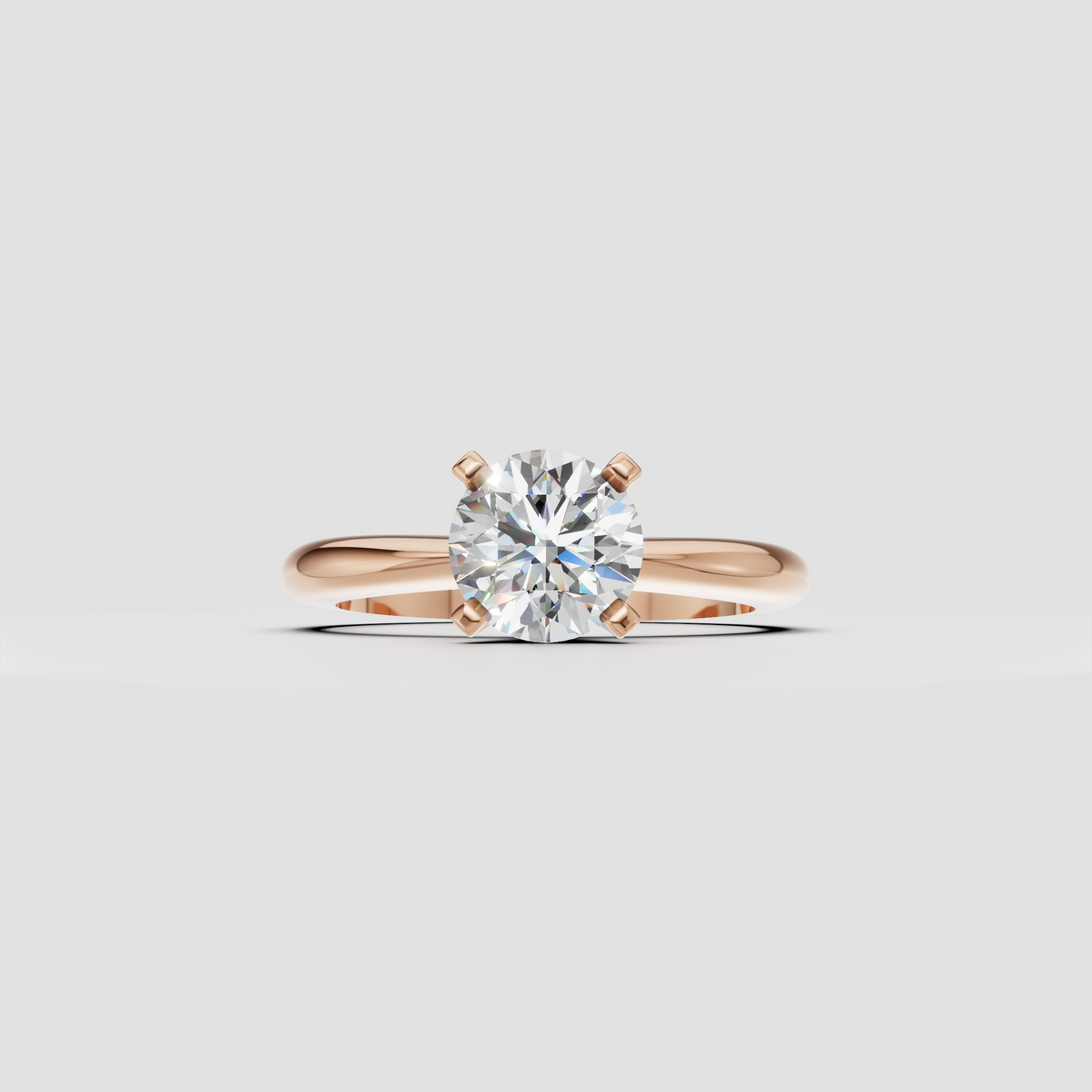 Elegant round diamond engagement ring with raised basket and refined split shank