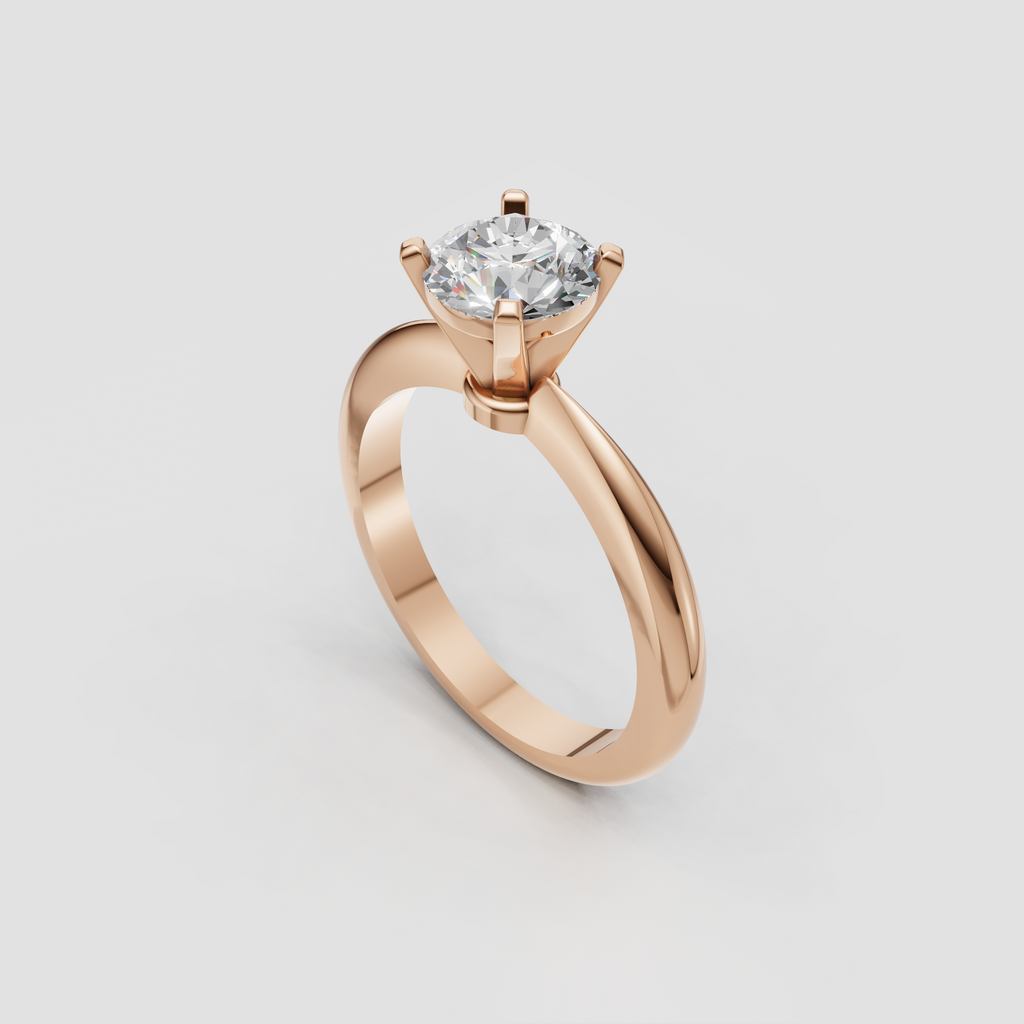 Round brilliant diamond solitaire ring with sleek platinum shoulders and four prongs