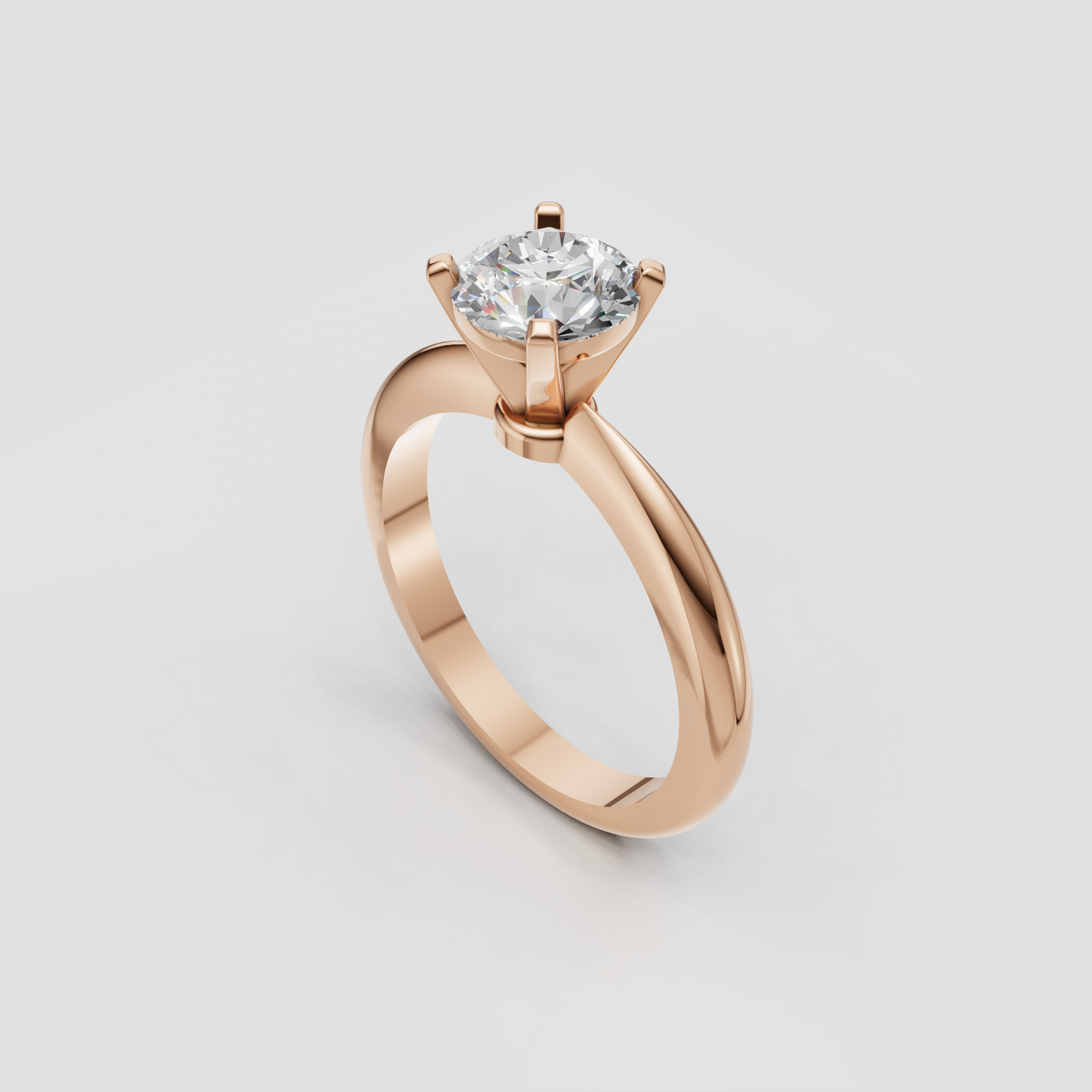 Round brilliant diamond solitaire ring with sleek platinum shoulders and four prongs