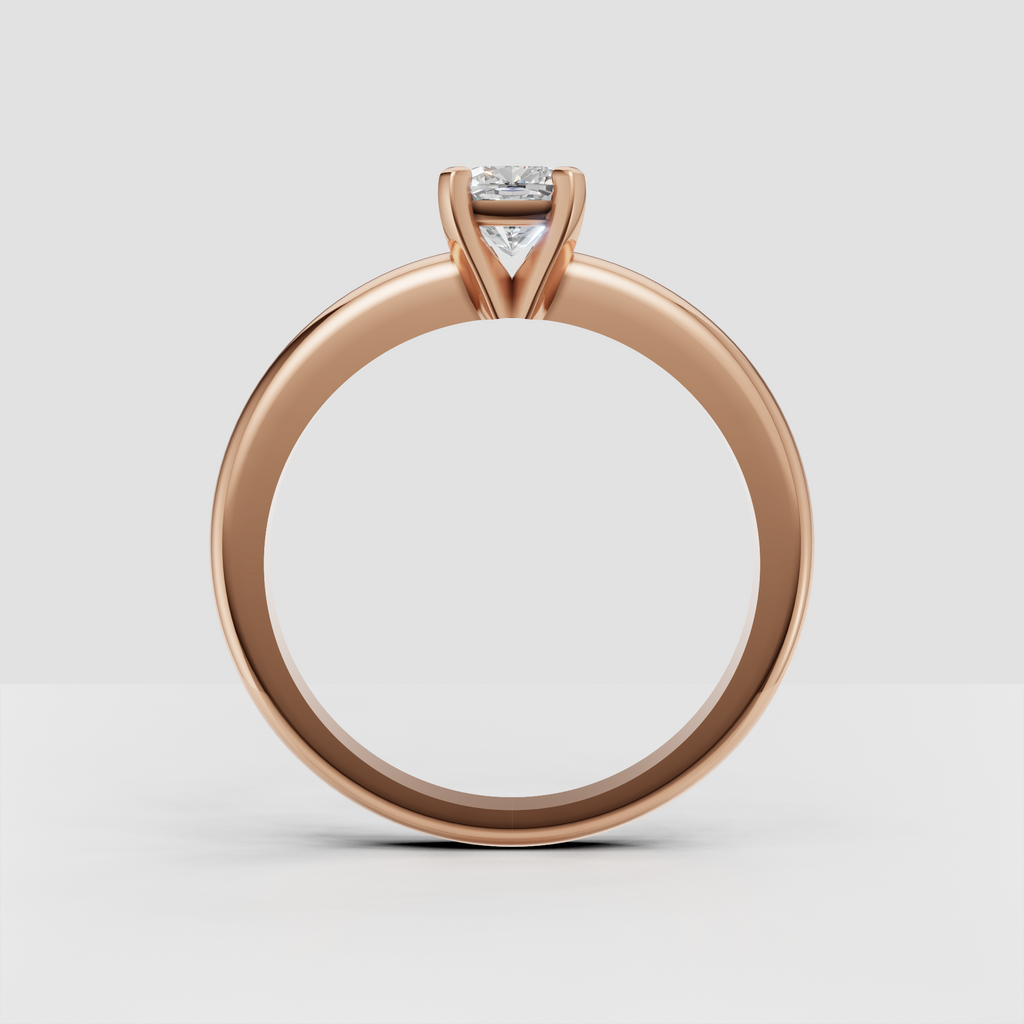 Four-prong round diamond engagement ring with clean contemporary band design