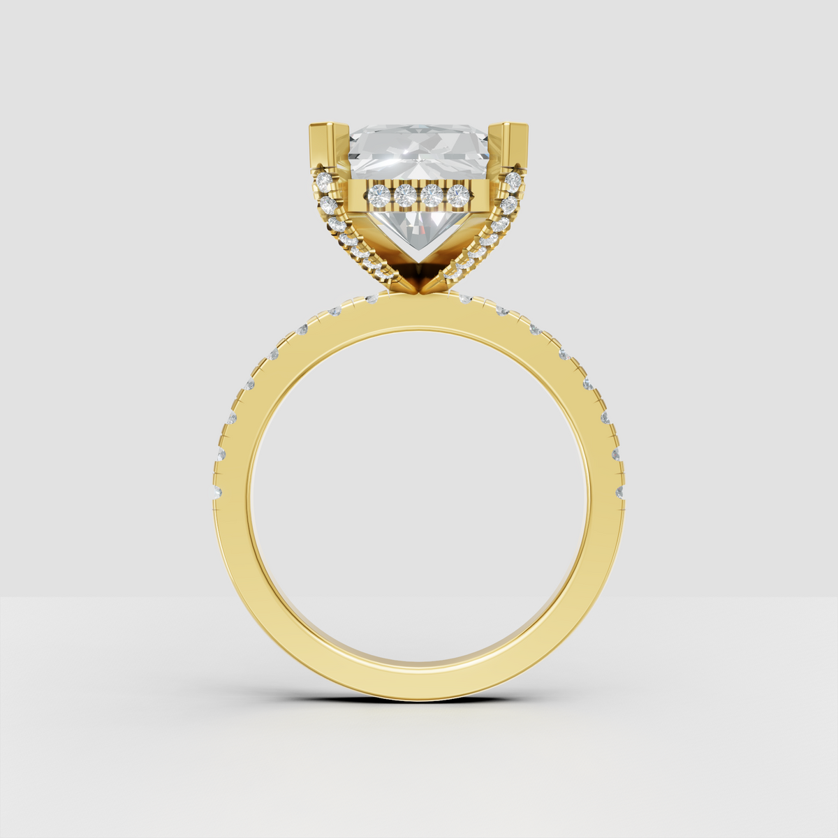 Elongated radiant cut diamond ring with four corner prongs