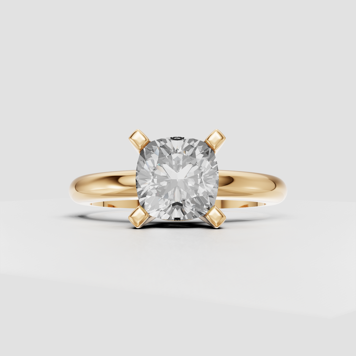Cushion diamond solitaire engagement ring with polished band