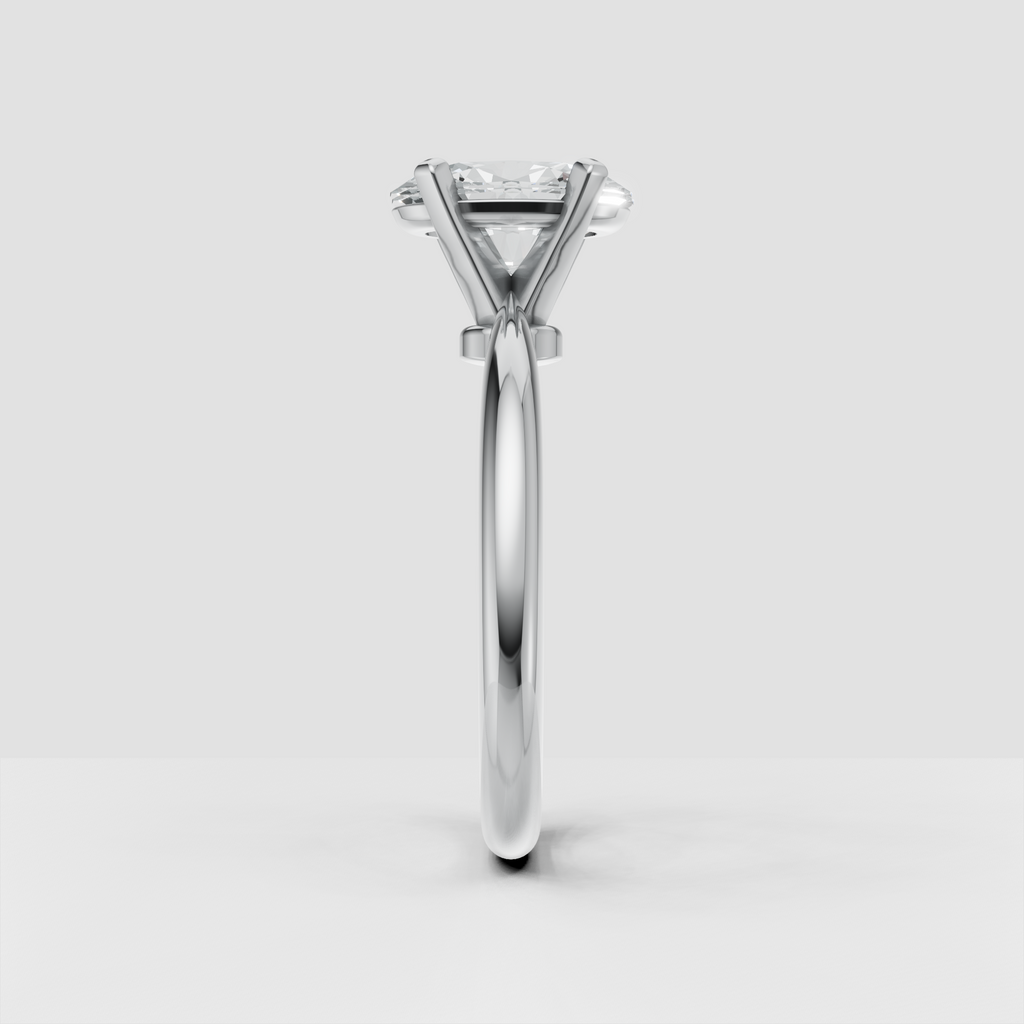 Four-prong oval diamond ring with a clean polished gold band
