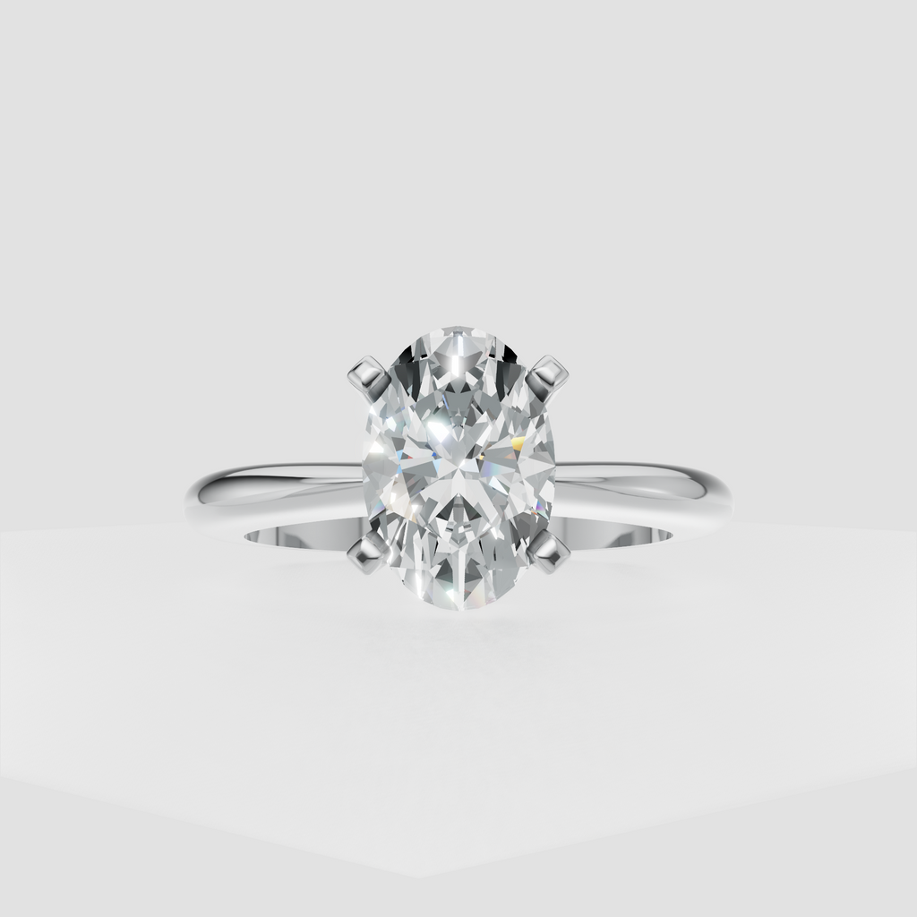 Oval diamond ring featuring a smooth polished gold band and elevated center setting