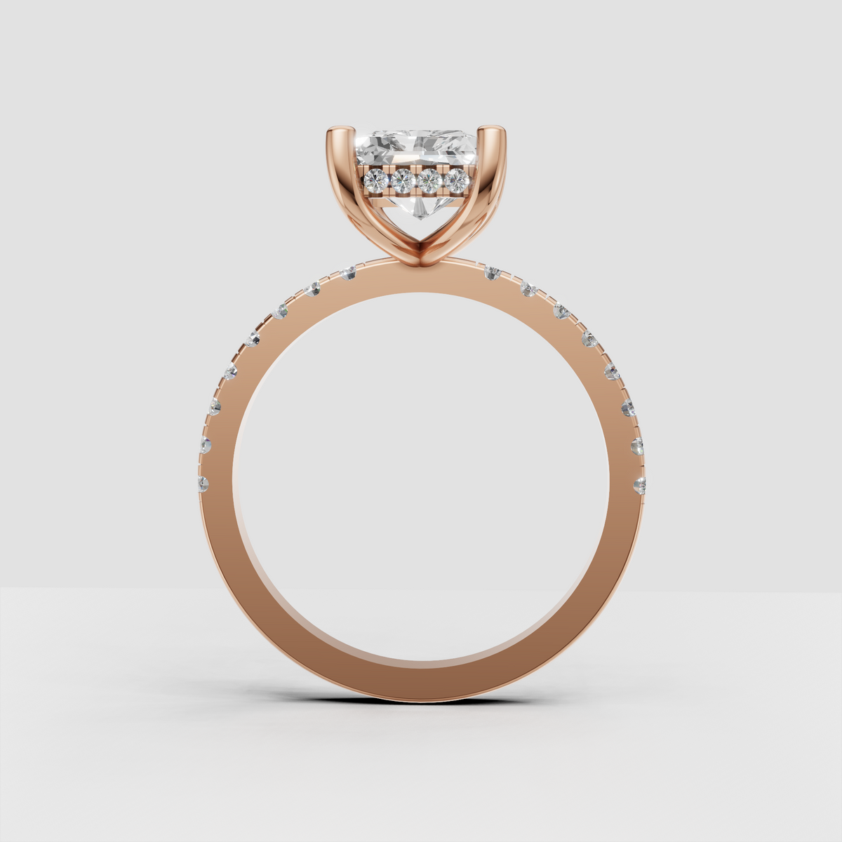Radiant diamond ring with four rounded gold prongs