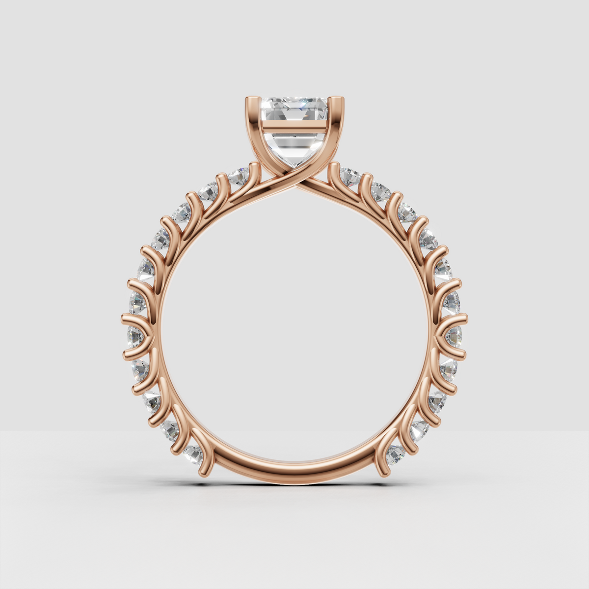 Emerald cut engagement ring with split shank pave design