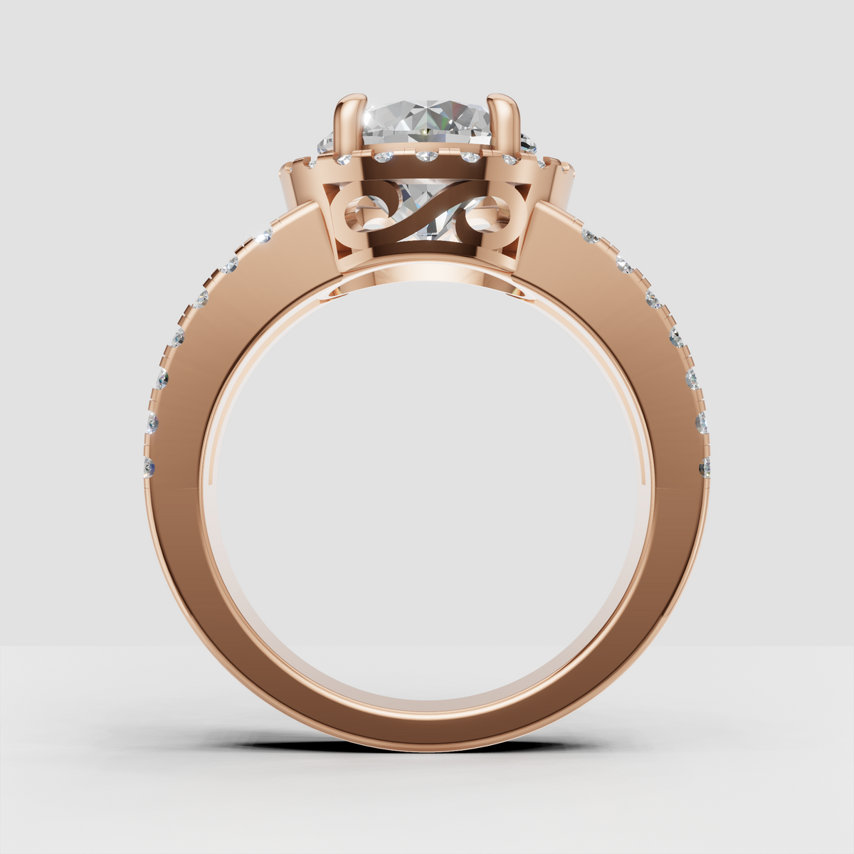 Detailed round diamond ring with pave split shank and decorative gallery