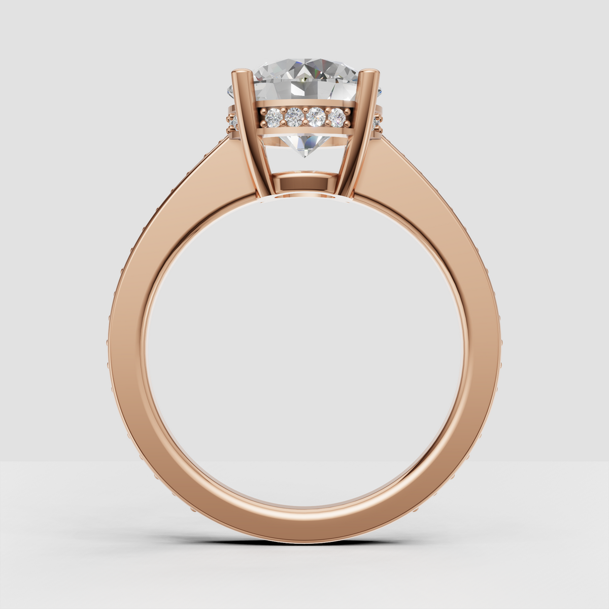 Modern classic round diamond engagement ring with four-prong setting.