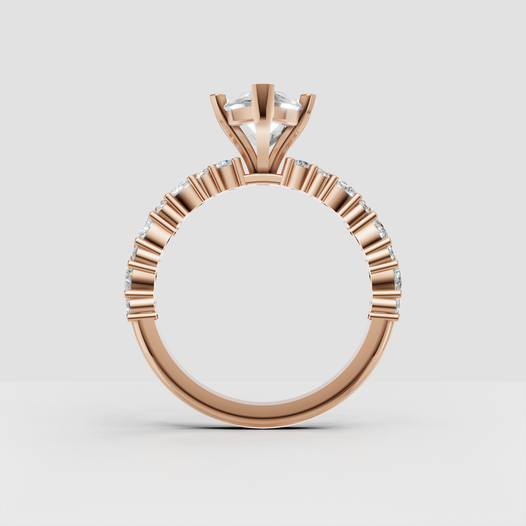 Yellow gold prong set marquise diamond solitaire with sparkling shoulders