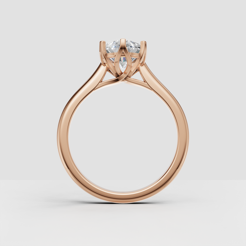 Pear diamond ring featuring a refined six-prong claw setting