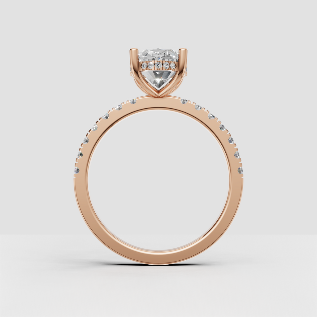 Oval diamond ring with sparkling side stones and four prong setting