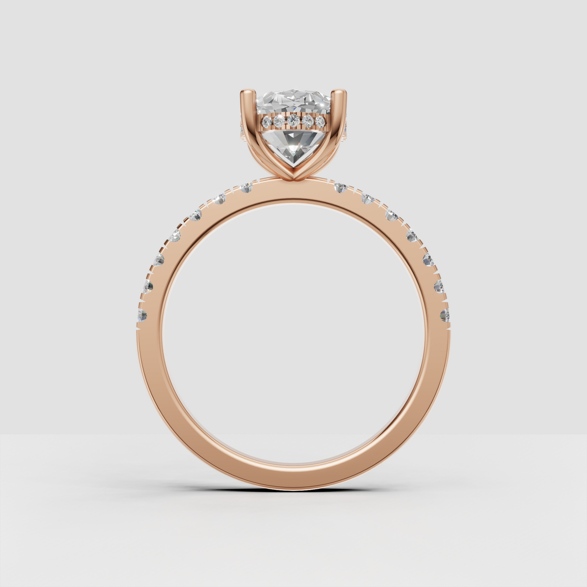 Oval diamond ring with sparkling side stones and four prong setting