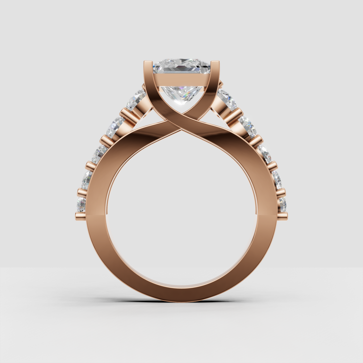 Princess diamond ring with polished gold band and prong set side diamonds