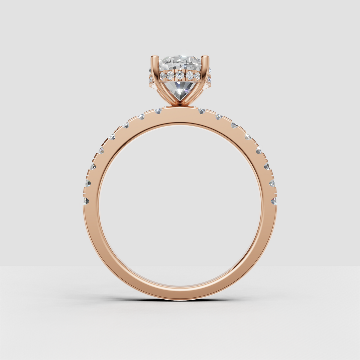 Perspective view of pear shaped diamond ring with detailed pavé shoulders