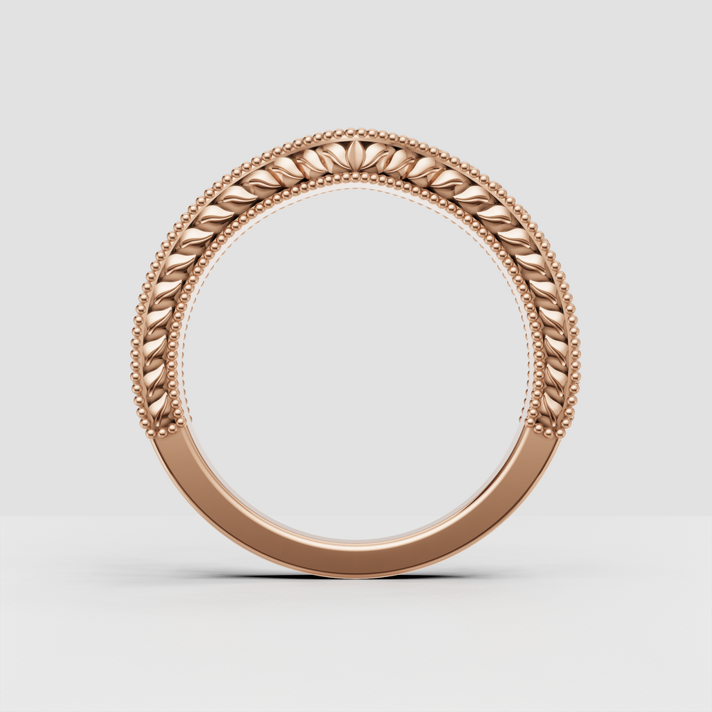 Round brilliant stones set in an ornate floral gold band