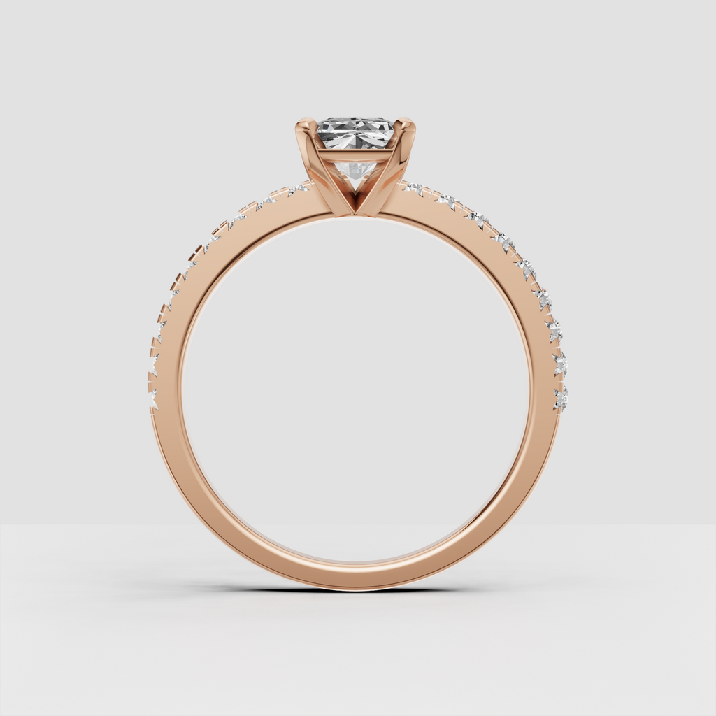 Radiant-cut Diamond ring featuring a slim pavé band and open gallery