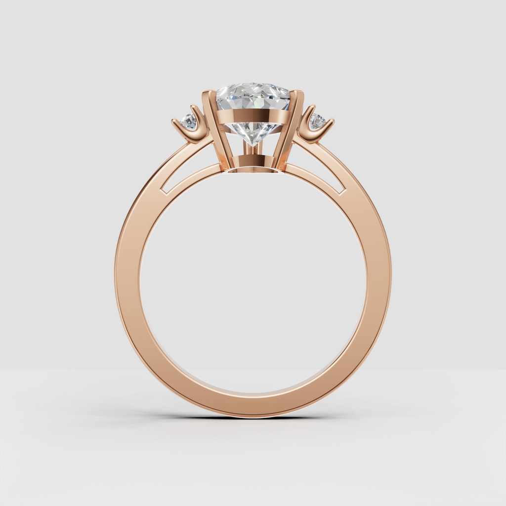 Yellow gold pear diamond ring with round side stones