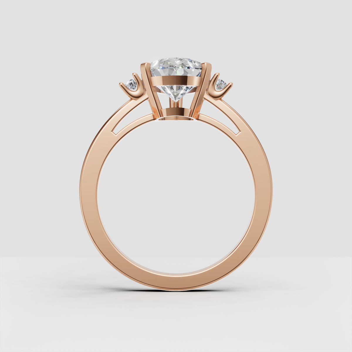 Yellow gold pear diamond ring with round side stones