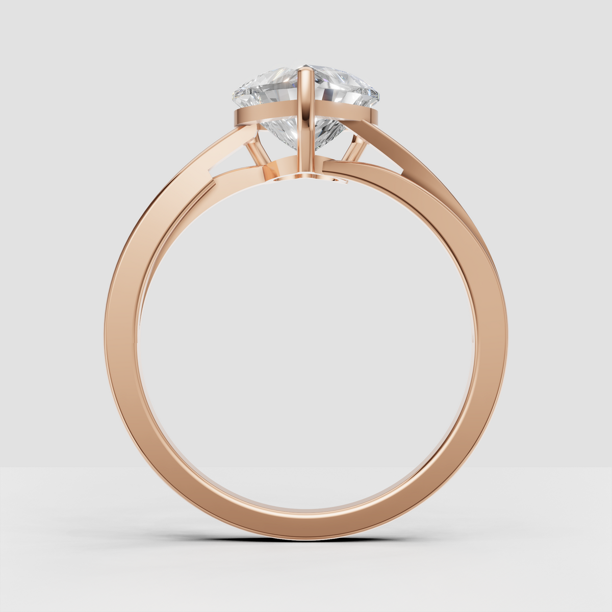 Heart diamond solitaire ring photographed from the side showing elevated setting