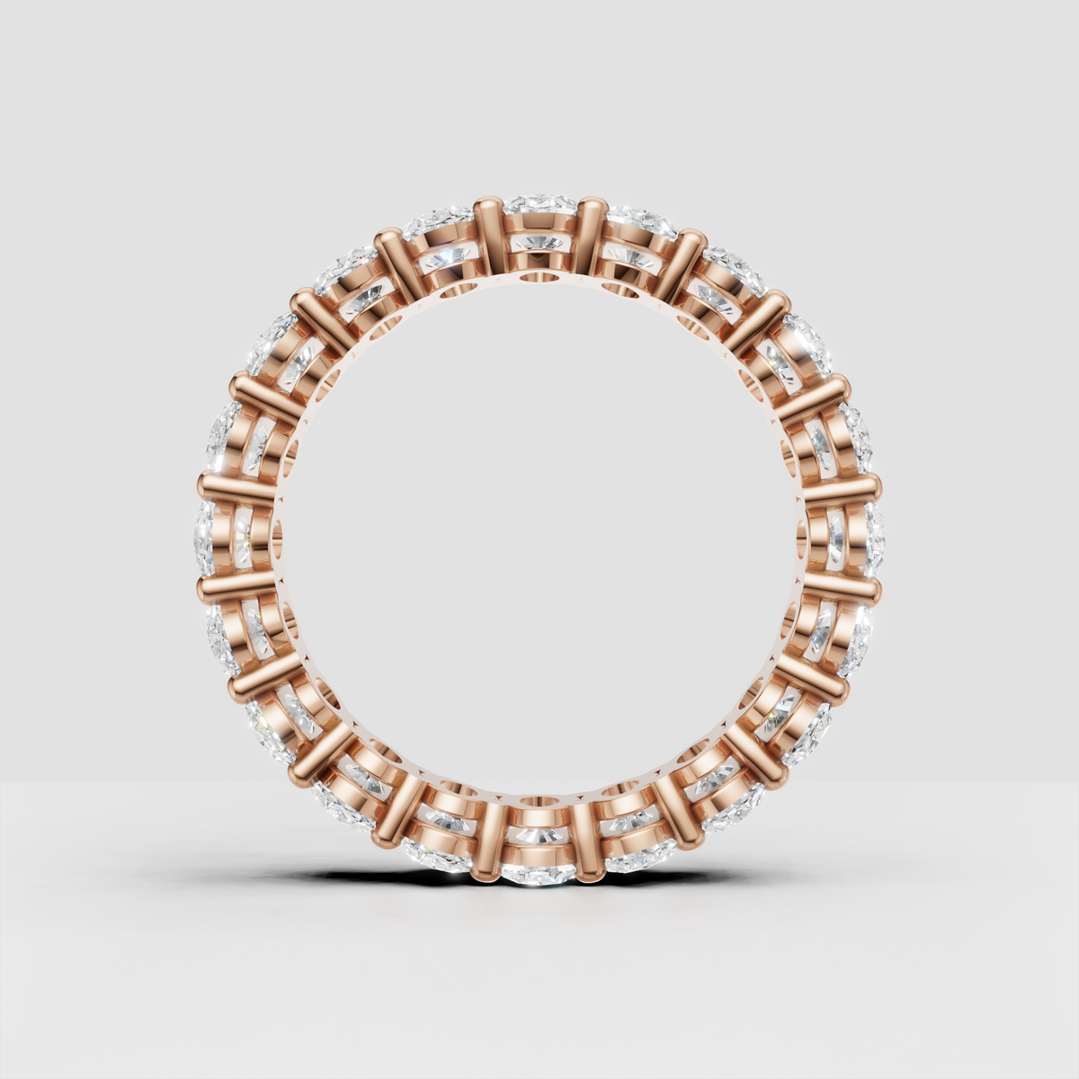 Oval cut gemstone ring with symmetrical full band design