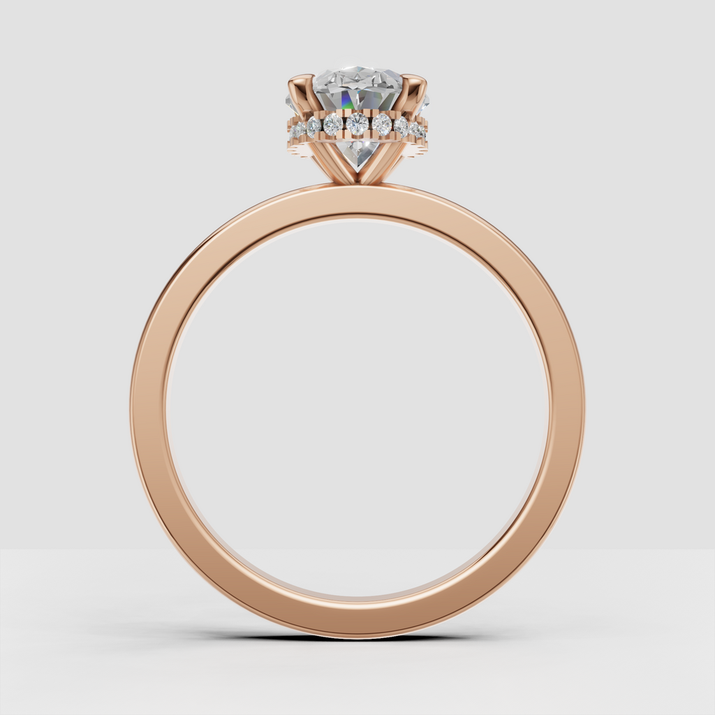 Polished yellow gold ring featuring an oval diamond center stone