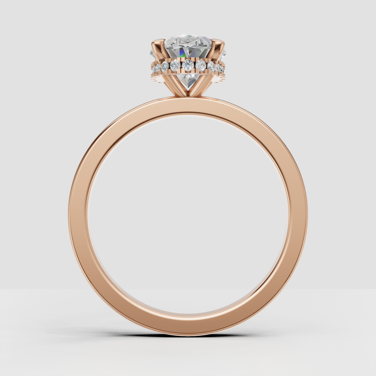 Polished yellow gold ring featuring an oval diamond center stone