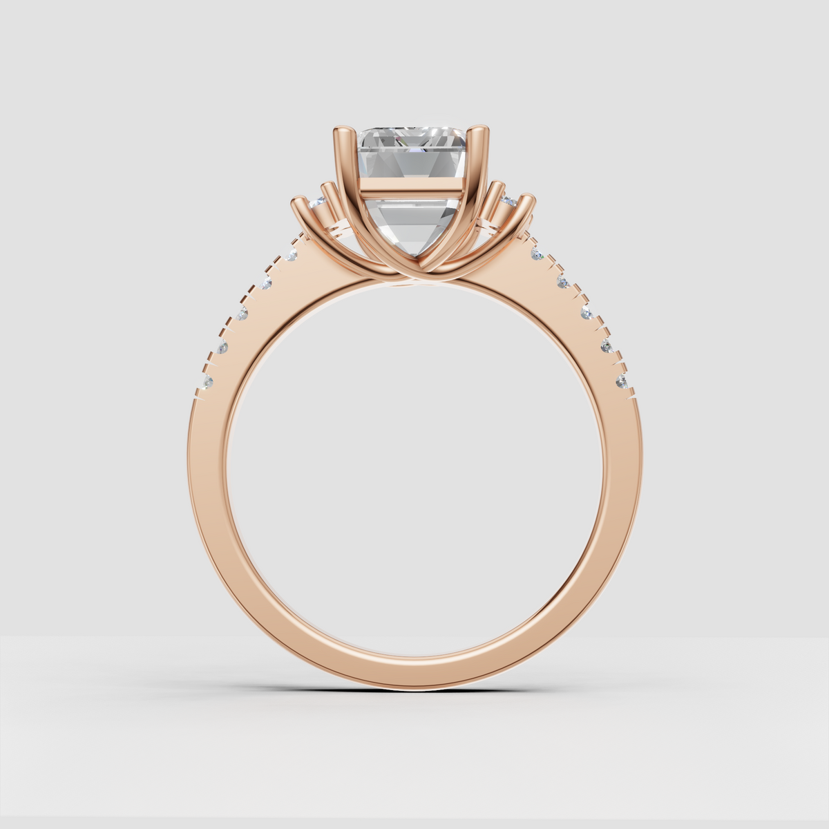 Emerald cut center diamond with symmetrical halo-inspired clusters